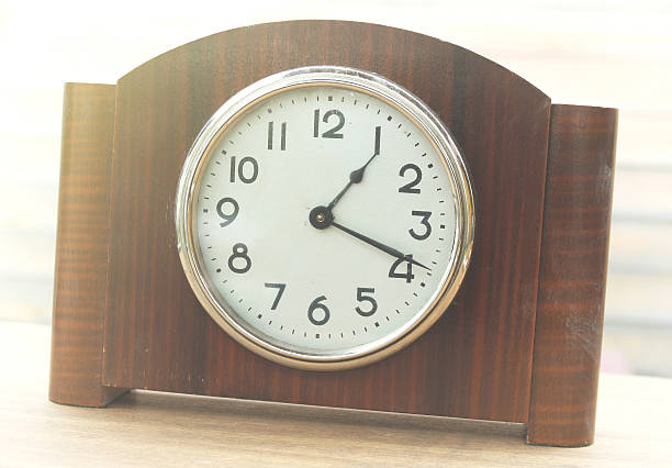 istock Desktop home watch on a wooden background 529672200