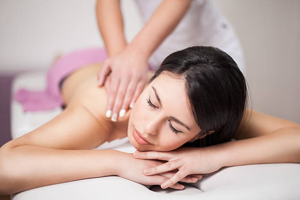 istock Young woman receiving back massage at spa 529672674