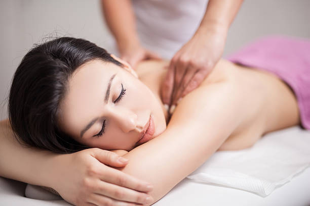 istock Young woman receiving back massage at spa 529673182