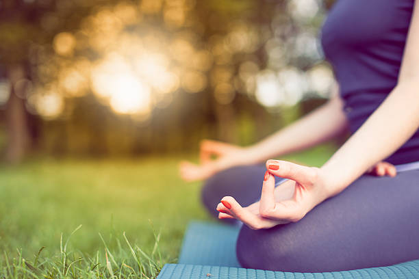 istock Young woman doing yoga 529673472