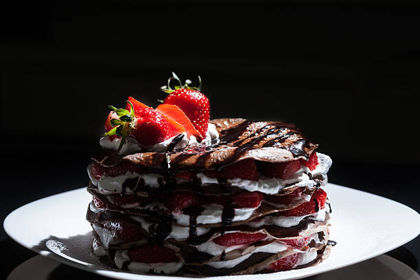 istock Delicious chocolate and white cream layered cake decorated with 529673508