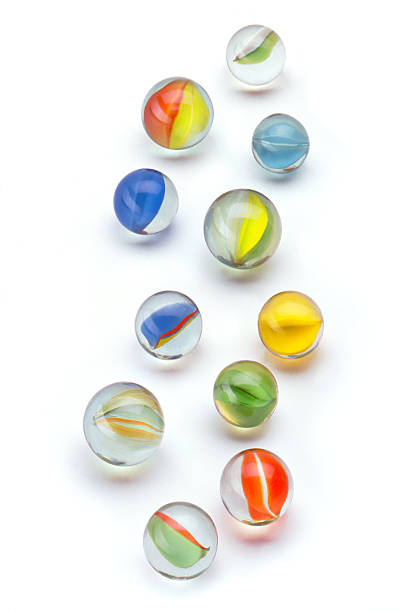 colored glass marbles on a white background stock photo