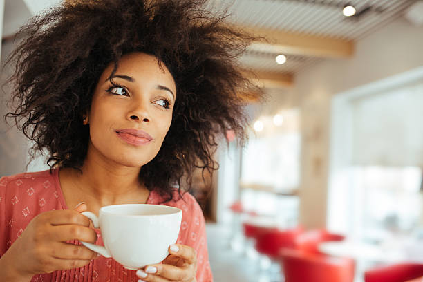 istock Young woman enjoying coffee 529676328
