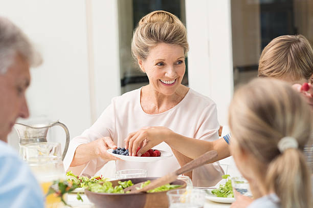 istock Grandmother serving food 529677804