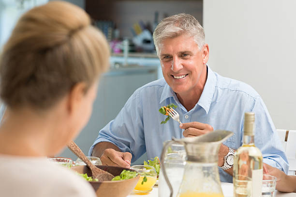 istock Senior man eating food 529678296