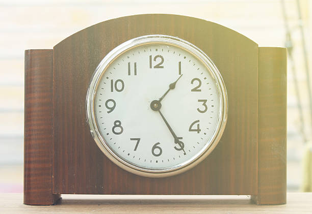 istock Desktop home watch on a wooden background 529679138