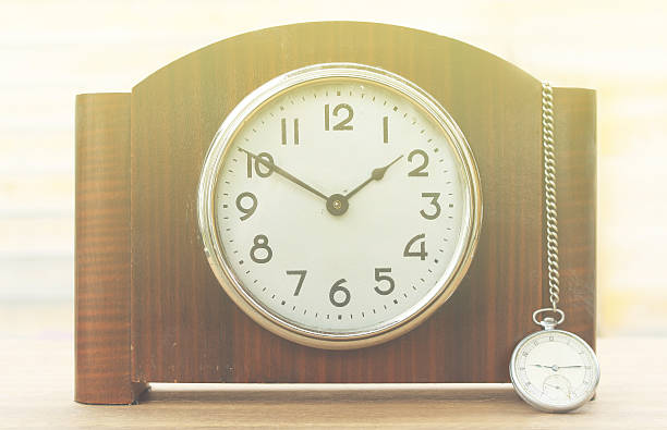 istock Desktop home watch on a wooden background 529679250