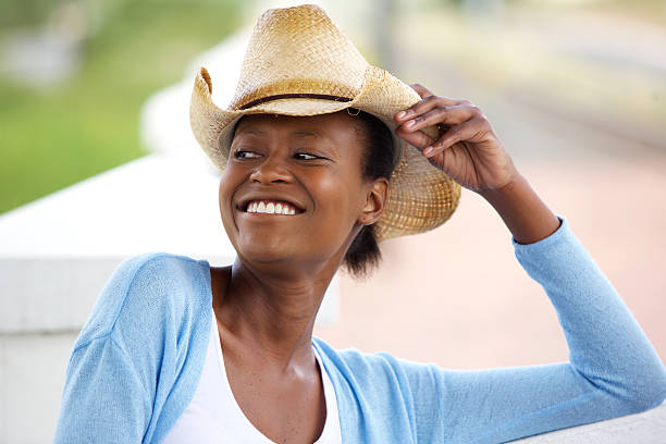 istock Smiling african woman with cowboy hat 529679468