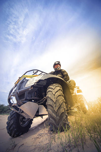 Racing ATV in the sand. Racing ATV in the sand in the summer on the prepared track. sand river stock pictures, royalty-free photos & images