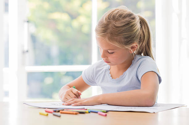 Young girl coloring picture