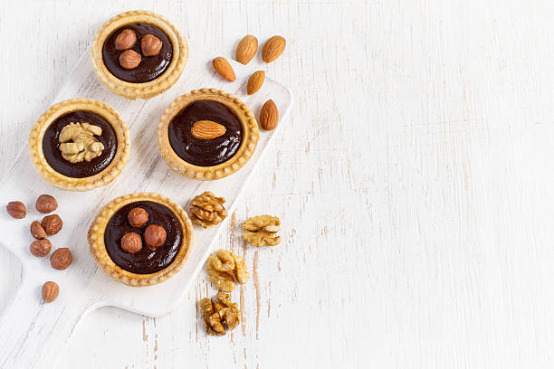 istock Almond walnut hazelnut chocolate small tarts 529681346