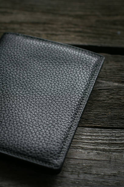 istock Black wallet on wooden board. 529681638