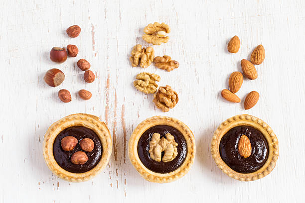 istock small Tarts with different nuts and chocolate, top view 529681656