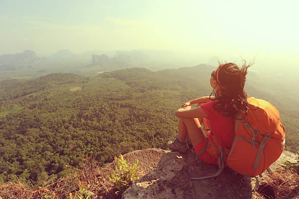 istock successful woman hiker enjoy the view on mountain top 529683590