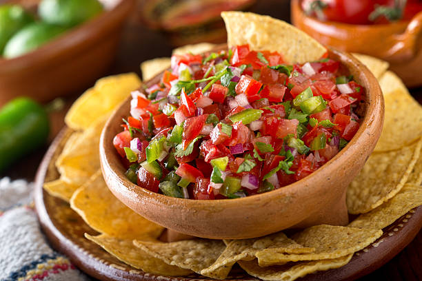 Pico De Gallo Sauce A delicious home made salsa pico de gallo with tomato, red onion, lime, cilantro, and jalapeno pepper. tortilla chip stock pictures, royalty-free photos & images