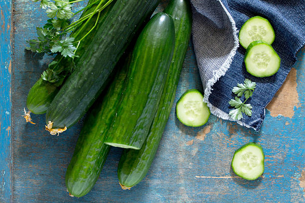 Fresh Organic Cucumbers On A Wooden Table Top View Stock Photo - Download  Image Now - iStock