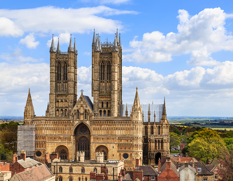 Lincoln, England - May 3, 2016: Front of Lincoln Cathedral. Scaffolding present on NW corner. Viewed from the walls of Lincoln Castle.