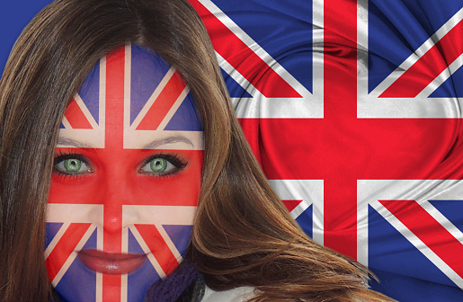 Attractive British woman with the flag painted on her face.
