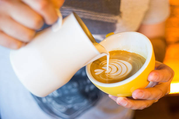 istock Barista Pouring Latte Froth Art 529688038