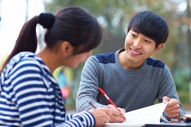 istock two asian college students study in the campus 529689153