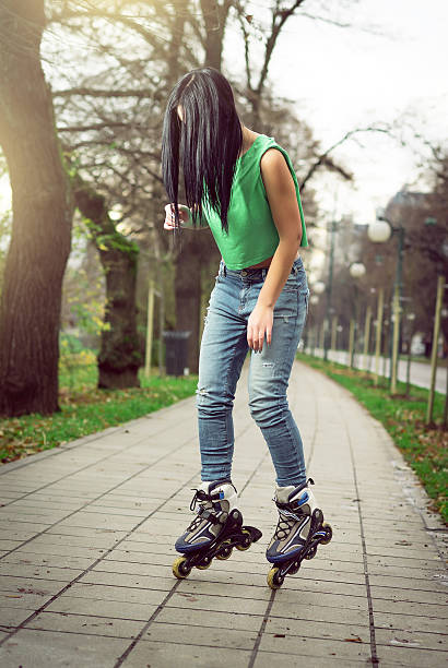 istock Girl roller skating in park 529689703