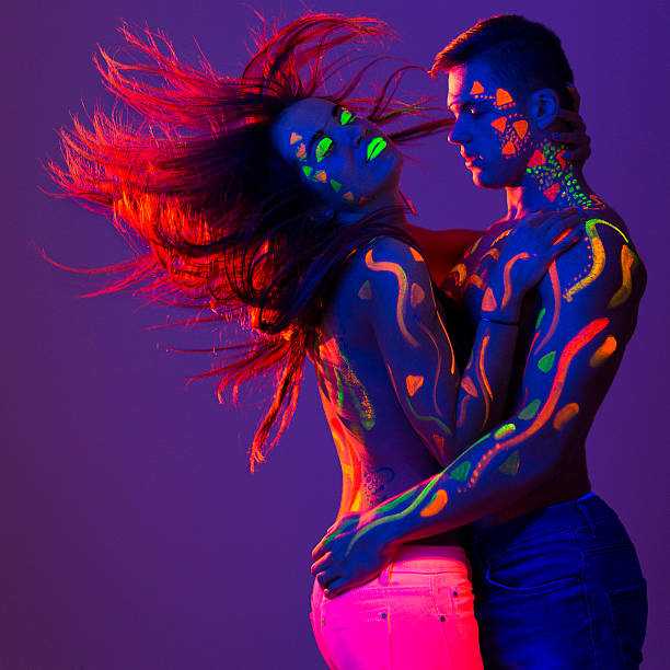 istock Beautiful couple in uv light 529690743