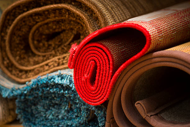istock rugs in rug store 529692835