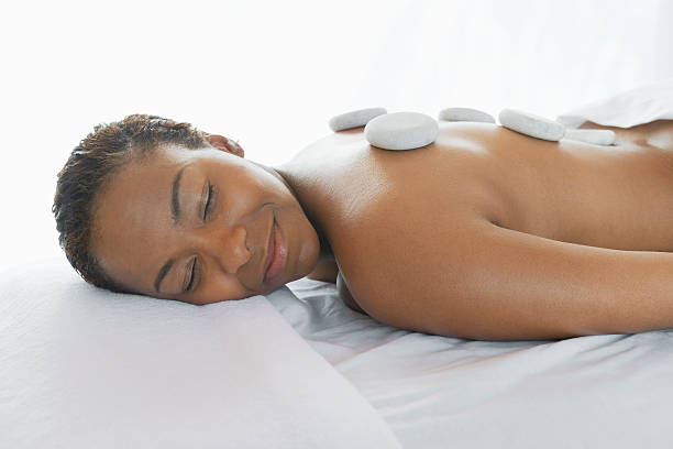 istock Woman Receiving Stone Therapy Treatment 529693903