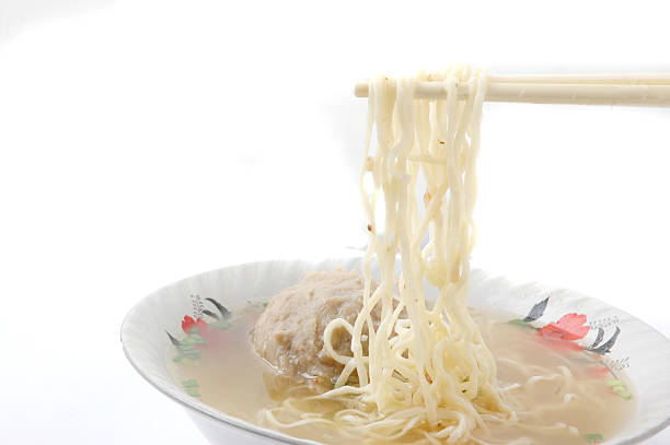 bowl of meatballs with sauce and noodles