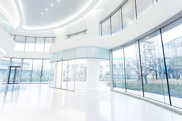 istock futuristic modern office building interior in urban city 529695287