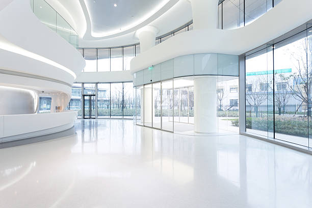 istock futuristic modern office building interior in urban city 529695289