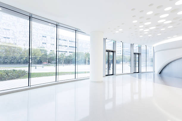 istock futuristic modern office building interior in urban city 529695563