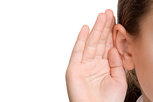 若い少女聞く - listening human ear communication human hand ストックフォトと画像