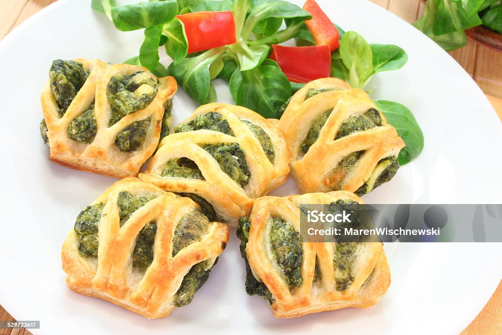 Puff pastry with spinach and cheese filling Puff pastry with spinach and cheese filling on a white plate Vol-au-Vent Stock Photo