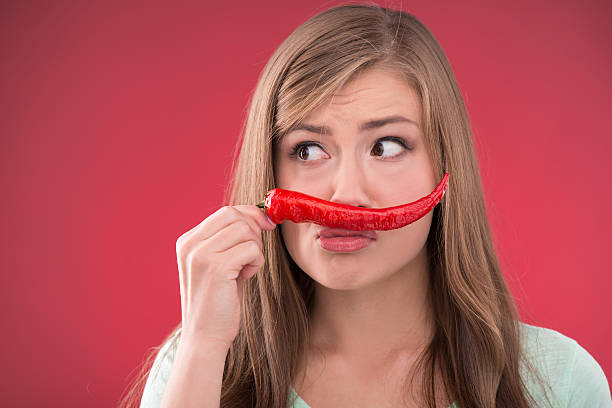 istock Beautiful girl on red background 529725633