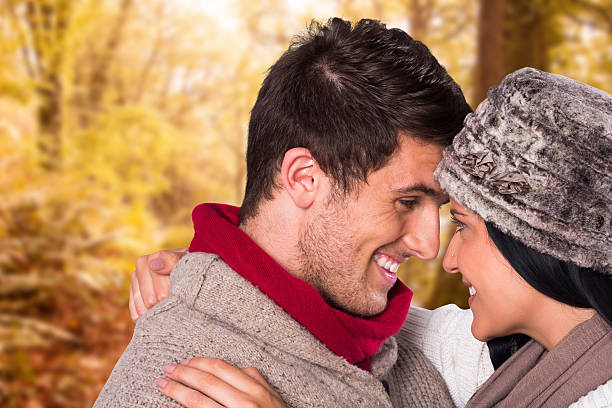 istock Composite image of young couple smiling and hugging 529726103