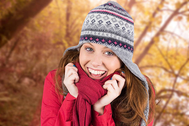 istock Composite image of cold redhead wearing coat and hat 529726195