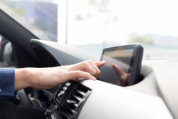 istock asian young businessman operates navigator in car 529727365
