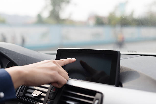 istock asian young businessman operates navigator in car 529727369