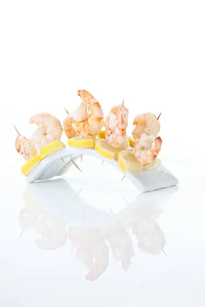 Prawn and lemon-slices in tooth picks