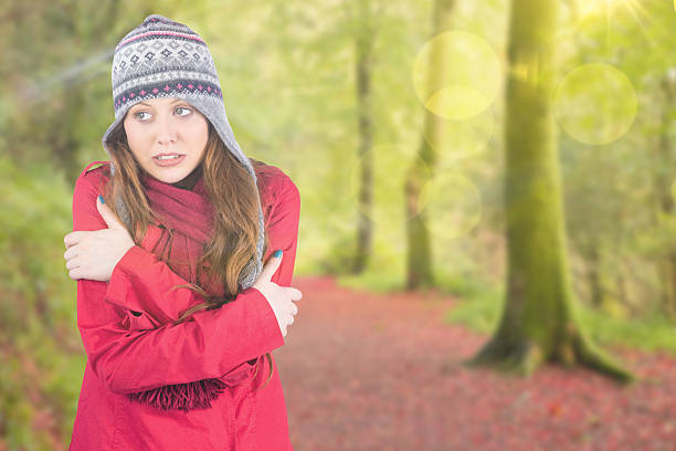 istock Composite image of cold redhead wearing coat and hat 529728651