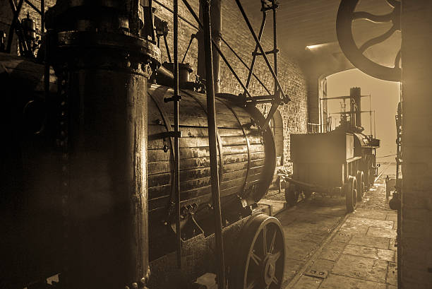 Old Sepia Picture Of An Old Steam Engine In a Locomotive shed