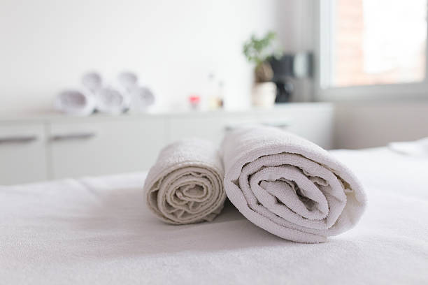istock Towels presented on bed in a spa salon 529730303