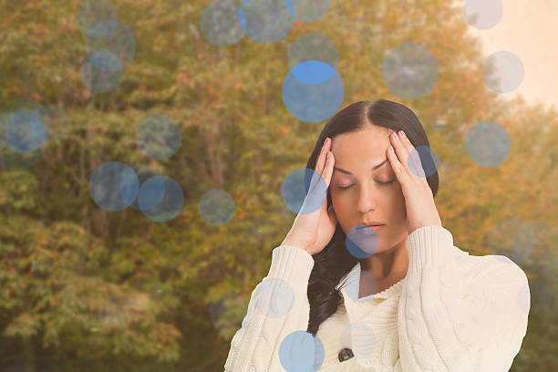 istock Composite image of woman suffering from a migraine 529742567