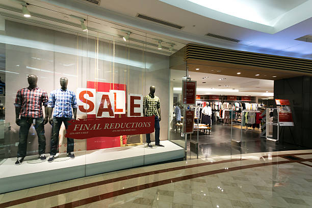istock clothes storefront window with sale poster 529742669