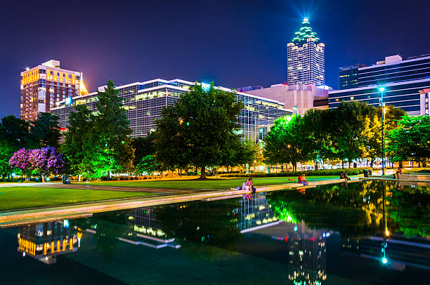 istock Reflecting pool and buildings at night, at Olympic Centennial Pa 529742701