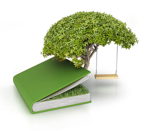 дерево растет из знаний book - book brown apple education стоковые фото и изображения