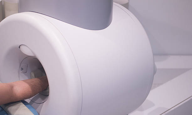 istock Patient in fully open MRI CAT Scan 529744443