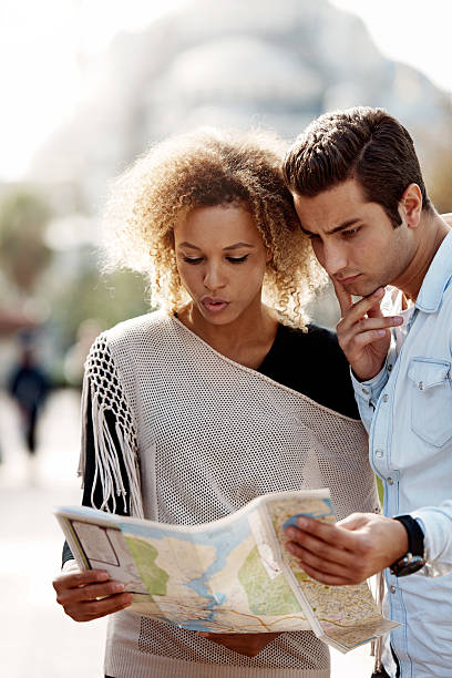 istock Tourists in front of Blue Mosque,looking at city map 529745617