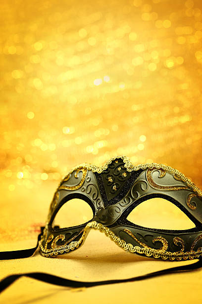 istock Vintage carnival mask in golden background 529746667